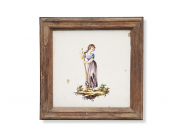 333.  Mujer barriendo.Azulejo de cerámica esmaltada.Alcora, primer cuarto del S. XIX.