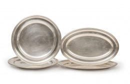 563.  Juego de cuatro fuentes de plata, dos ovales y dos circulares, con marcas incisas W.M.F.N.