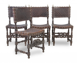 554.  Lote de cuatro sillas portuguesas en piel grabada y tachonada.Portugal, h. 1900.