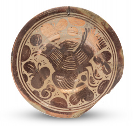1231.  Plato de cerámica de reflejo metálico con pajarito.Manises, S. XVIII.