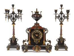 1226.  Guarnición de reloj y candelabros de mármol y bronce.Firmado en la esfera F. Ganter* Madrid, segunda mitad del S. XIX.