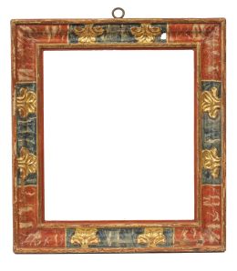 518.  Marco de madera tallada, policromada y dorada, decorado con hojas.Trabajo español, S. XVII.
