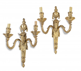 591.  Pareja de apliques Luis XVI de bronce dorado de dos luces.Francia, S. XIX.