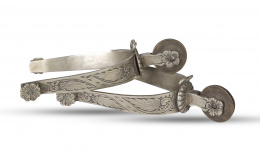 709.  Pareja de espuelas en plata cincelada, S. XIX.