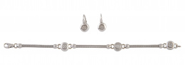 306.  Conjunto de pulsera y pendientes con brillantes en botones circulares  y oro blanco 