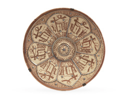 646.  Plato historicista de cerámica esmaltada de reflejo metálico.Manises, h. 1900.