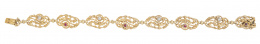 107.  Pulsera Art-Nouveau con ocho piezas ovales de motivos vegetales con centro de brillante y rubí alternos