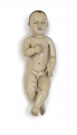 683.  "Niño Jesús".Marfil tallado y parcialmente policromado.Trabajo hispano-filipino, S. XVII.