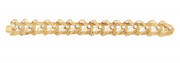 363.  Brazalete años 50 con brillantes en línea central rodeados por piezas de cordoncillo de oro entralazadas y articuladas entre sí
