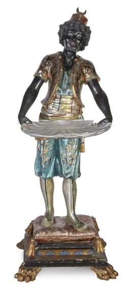 1178.  "Blackamoor sosteniendo una venera" de madera tallada, lacada y policromada.Trabajo veneciano, ff. del S. XIX - pp. del S. XX.