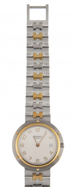 399.  Reloj HERMÈS Clipper, en acero y plaqué or