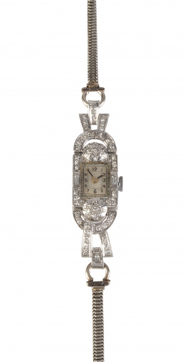 353.  Reloj de pulsera Art-Decó para señora, en platino decorado con brillantes y baguettes