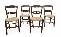 535.  Juego de cuatro sillas de madera de nogal con asiento de enea.Trabajo catalán, S. XIX.