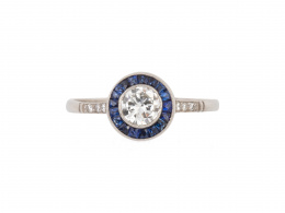 264.  Sortija de ojo de perdiz de estilo Art-Decó con brillante central orlado de zafiros calibrados