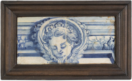 547.  Cenefa de dos azulejos de cerámica esmaltada en azul y blanco con cabeza de "putti".Talavera, S. XVI.