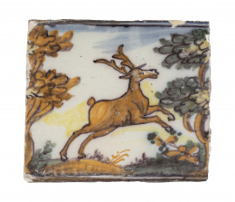 550.  Azulejo de cerámica esmaltada con ciervo en paisaje.Triana, S. XVIII.