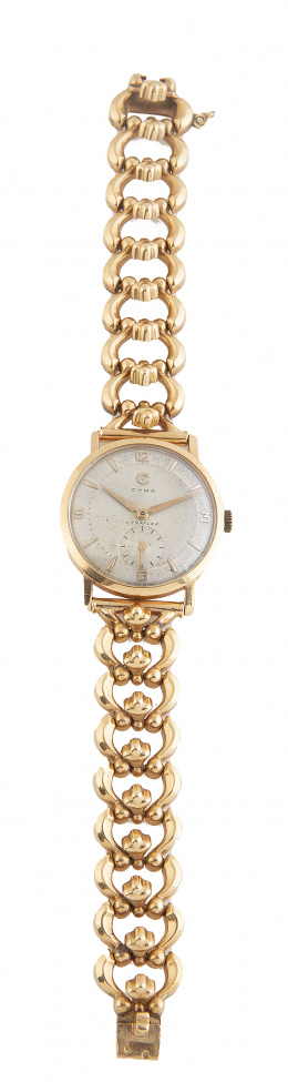 454.  Reloj CYMA años 50 en oro con pulsera articulada