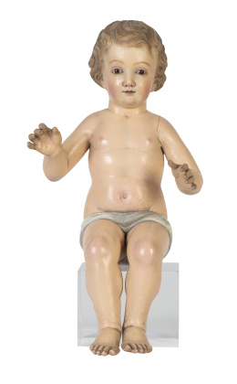 1036.  Niño Jesús.Escultura en madera tallada y policromada, los ojos de pasta vítrea.España, S. XIX.