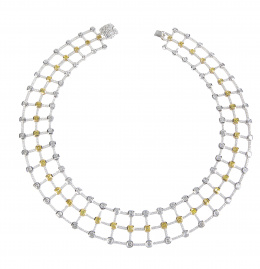 385.  Elegante gargantilla articulada de diamantes yellow e incoloros, unidos por retícula completamente cuajada de brillantes