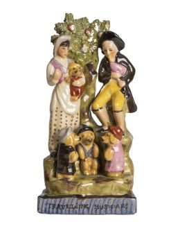 695.  "Travelling musicians".Grupo de loza esmaltada.Inglaterra, S. XIX.