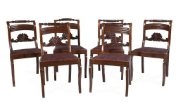 731.  Juego de seis sillas de madera de caoba tallada.España, S. XIX.