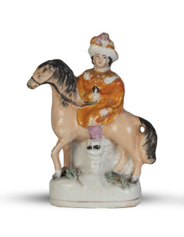 1198.  Dama a caballo, quizás la Reina Victoria.Figura de loza esmaltada.Staffordshire, Inglaterra, S. XIX.