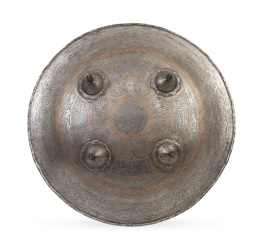 1169.  Escudo circular de metal con decoración grabada y decoración dorada.Trabajo persa, S. XIX.