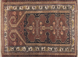 594.  Alfombra paquistaní en lana de campo marrón.

