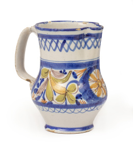 1079.  Jarro de cerámica esmaltada en azul cobalto y amarillo con cenefa de flores.Manises, S. XIX.