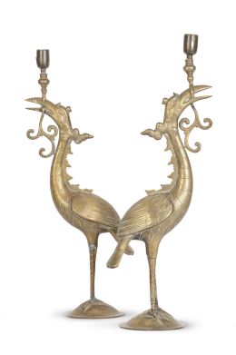1259.  Pareja de candeleros de metal dorado en forma de garza.S. XX.