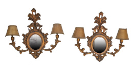 1308.  Pareja de apliques de dos brazos de luz de madera tallada y dorada con espejo.S. XX.