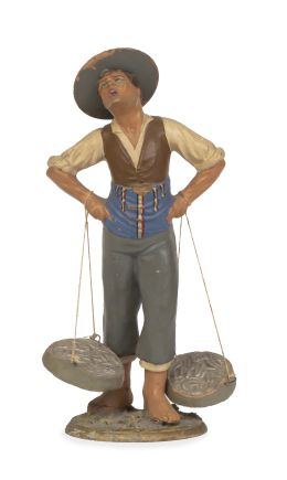 700.  El cenachero.Figura de barro policromado.Trabajo malagueño, S. XIX.
