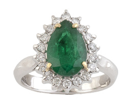 381.  Sortija con esmeralda talla pera orlada de brillantes