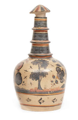 699.  Botella de cerámica esmaltada de barro pulido y policromado.Trabajo mejicano, ff. del S. XIX - pp. del S. XX.
