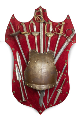 1132.  Panoplia con parte de armadura, ocho espadas, dos puntas de lanza y una daga.España, S. XIX.