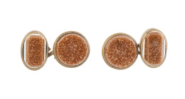 327.  Gemelos dobles de pp. S XX con frentes circulares y ovales con vidrio aventurina