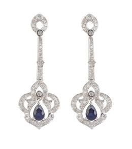 199.  Pendientes largos de zafiros y brillantes con diseño de flor lobulada colgante de banda superior