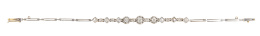 164.  Pulsera de pp. S. XX con diamantes en rombos y tres centros de brillantes en orla ondulada