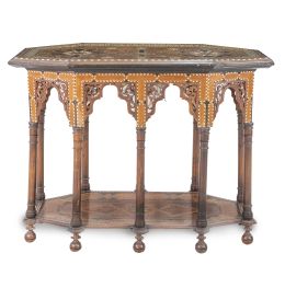 1088.  Mesa neomudéjar de varias maderas con marquetería geométrica y de estrellas e incrustaciones de hueso.Trabajo granadino, ff. del S. XIX - pp. del S. XX.