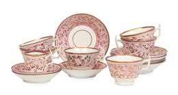 701.  Juego de seis tazas con sus platos de cerámica esmaltada de reflejo metálico con decoración en rosa.Inglaterra, S. XIX.