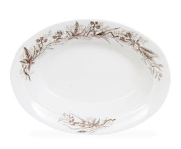 688.  Fuente ovalada de loza esmaltada con ramas. Con marca en la base.Pickman, Sevilla, (1880-1899).