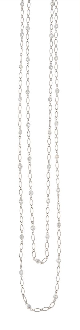 78.  Cadena larga TIFFANY & Co con cuarenta chatones de brillantes alternos con tramos de estilizada cadena