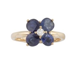 195.  Sortija flor con cuatro zafiros de talla oval a modo de pétalos y brillante central