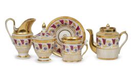 1163.  Juego de té Luis Felipe de porcelana esmaltada y dorada con cenefa de flores.Paris, h. 1830-1840.
