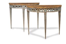 600.  Pareja de consolas neoclásicas de media luna de madera tallada, policromada de azul y dorada con tapa de mármol.Trabajo italiano, h. 1800.