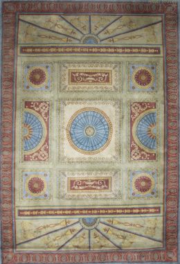 1146.  Alfombra en lana de campo rosa y cartela central en azul de estilo Carlos IV.Firmada Miguel Stuyck.