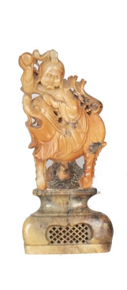 1213.  Piedra jabón tallada con personaje sobre animal.China, S. XIX.