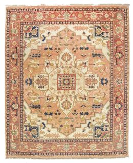 572.  Alfombra en lana con campo beige y salmón y cartela central. Akbar, India.