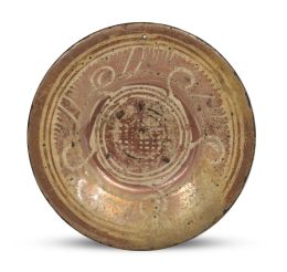 569.  Plato de cerámica esmaltada de reflejo metálico.Manises, segunda mitad del S. XVII.