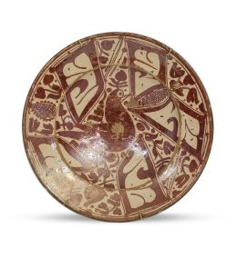 579.  Plato de cerámica esmaltada de reflejo metálico con parladot.Cataluña, S. XVI.